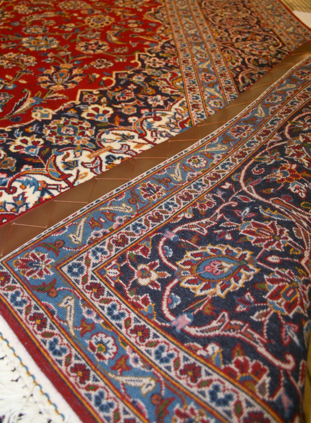 Close-up of a patterned rug with intricate designs.