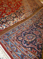 Close-up of a patterned rug with intricate designs.